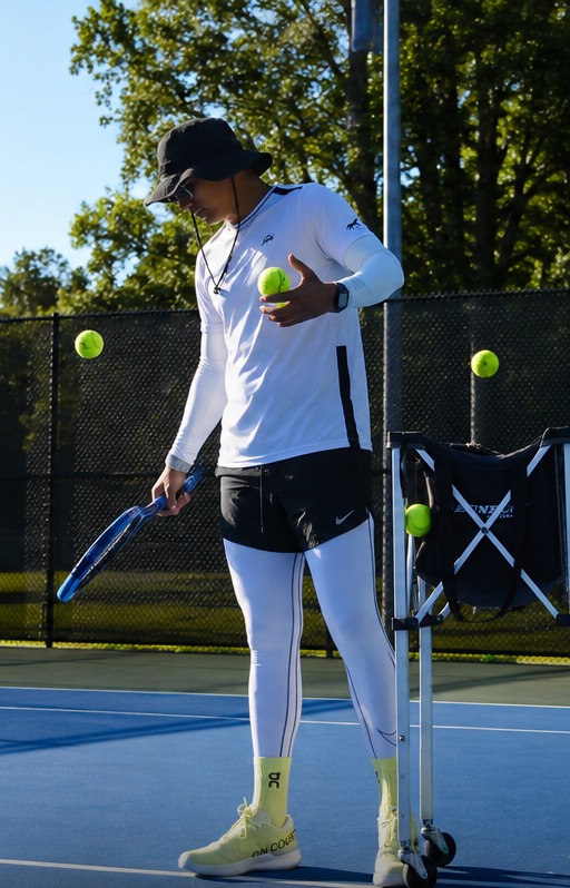 Coach Jose feeding balls during a private session